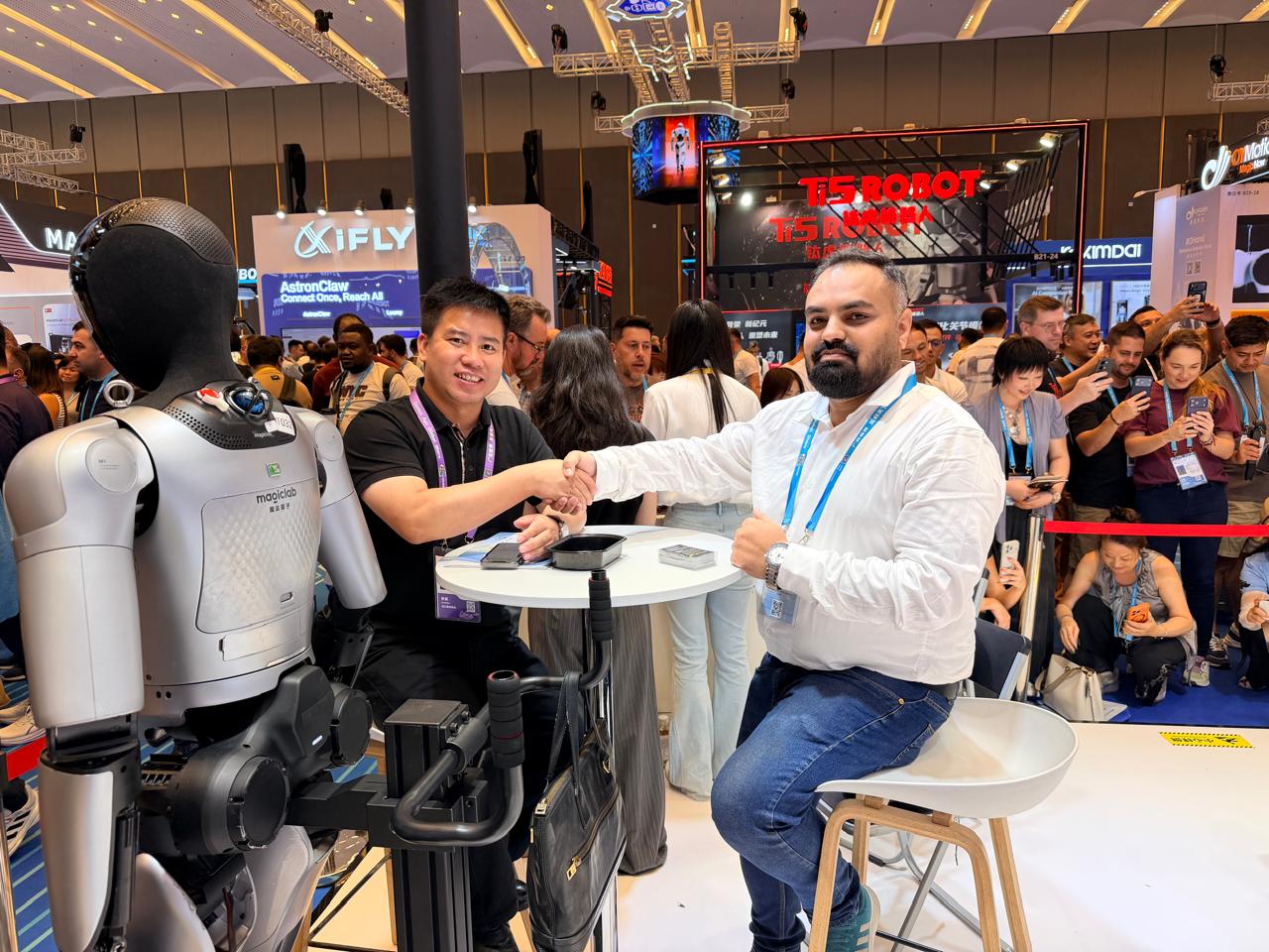 Nexera Sourcing founder shaking hands with an exhibitor at the Canton Fair